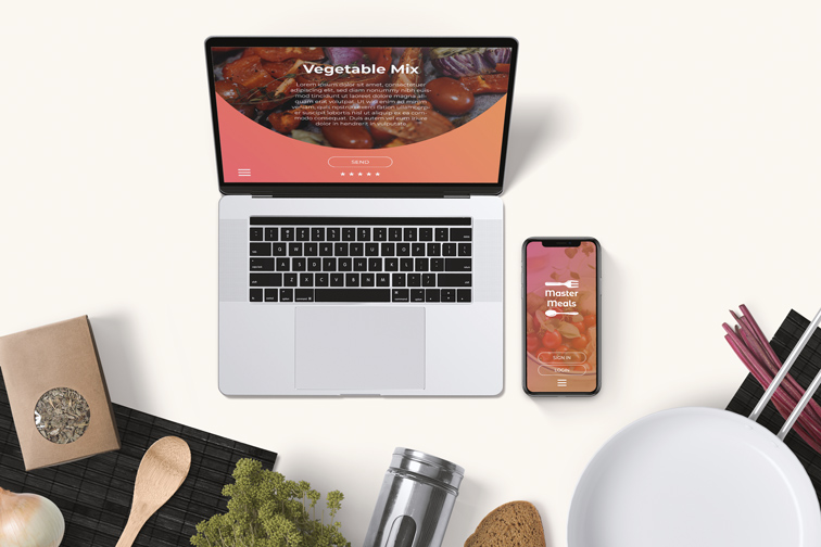 Portátil y iPhone sobre un fondo de cocina