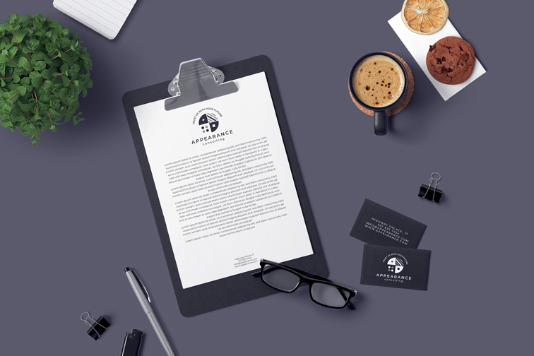 Clipboard and Business Cards on a Desk