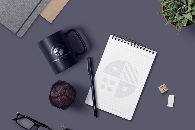 Spiral Notepad, Pen, and Cup on a Desk