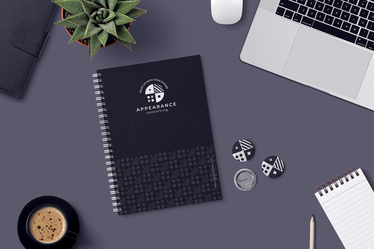 Notepads, Pin Buttons, and Office Supplies on a Desk