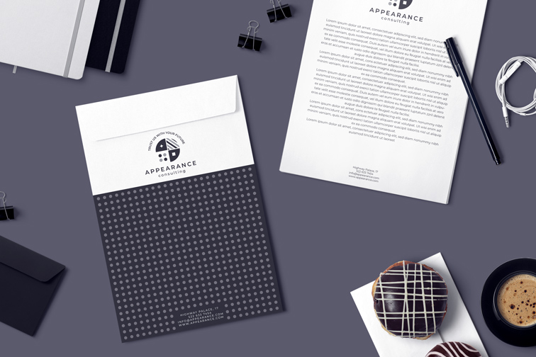 A4 Envelope, Business Flyer, and Pen on a Desk