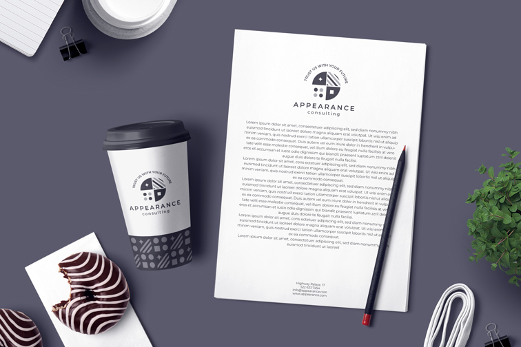 Business Flyer, Pencil, and Paper Cup on a Desk