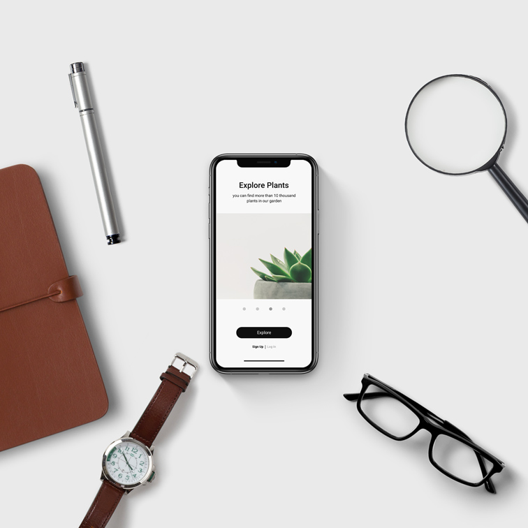 iPhone with Office Supplies on a White Desk