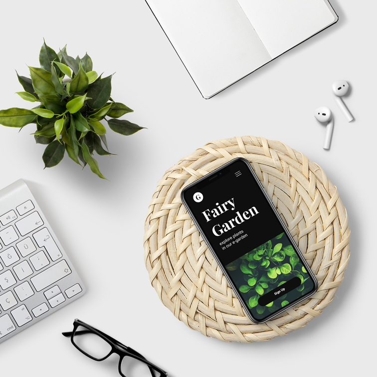 iPhone and AirPods on a White Desk