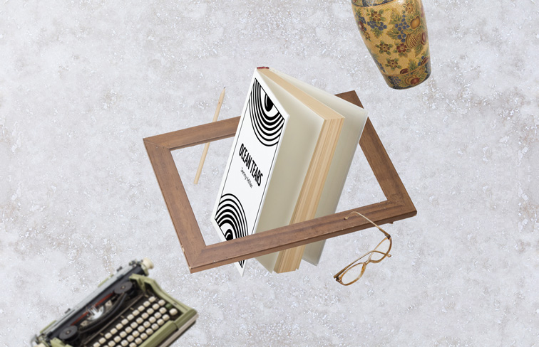 Hardcover Book and Retro Frame in the Air