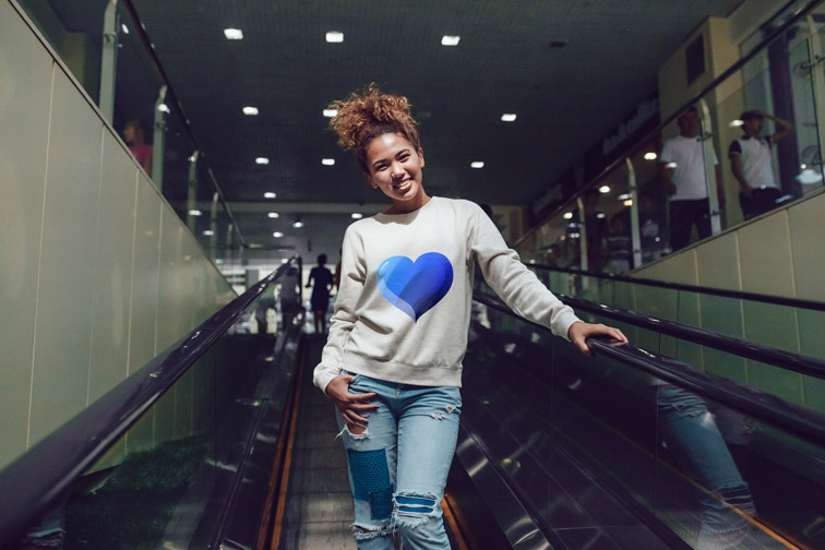 Girl Going Down on an Escalator