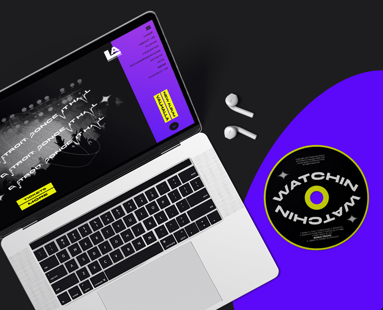 Laptop with AirPods and a Compact Disc