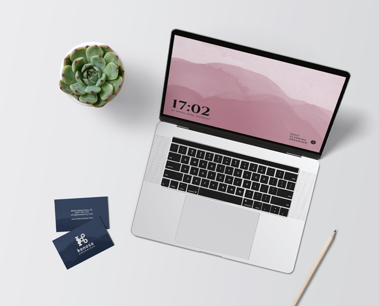 Workspace with a Laptop and Business Cards