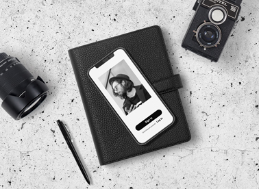 iPhone, Camera, and Lens with a Notepad