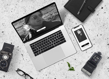 Photographer Desk with a Laptop and an iPhone