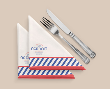 Two Folded Napkins next to Cutlery