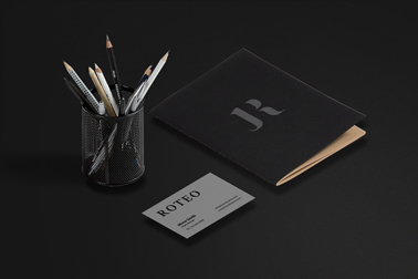 Sketchbook, a Business Card, and a Pen Stand 