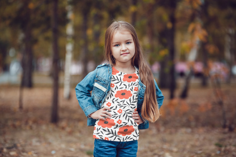 Little Girl among Autumn Trees