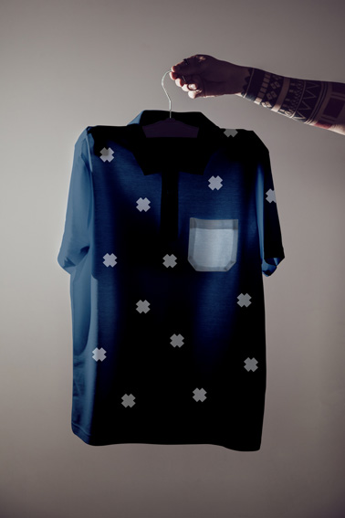 Hand Holding Hanger with a T-shirt