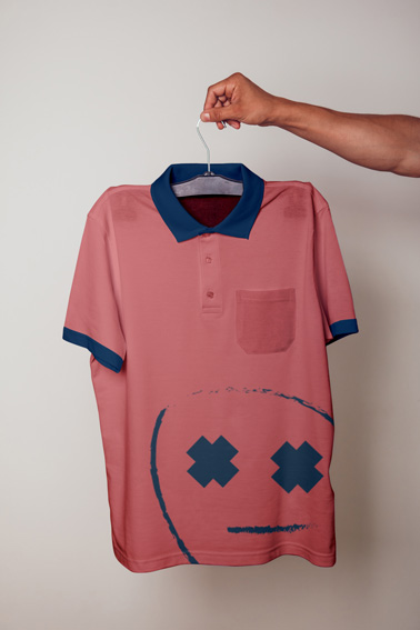 Hand Holding Hanger with a Polo Shirt