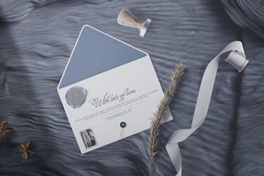 Envelope with a Stamp and a Ribbon Roll