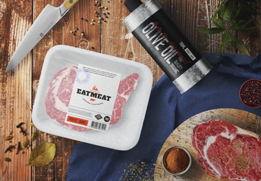 Meat Package and Oil Bottle on a Cooking Table