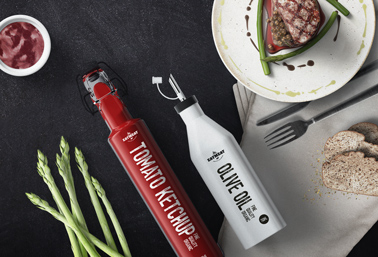 Ketchup and Oil Bottles on a Dining Table