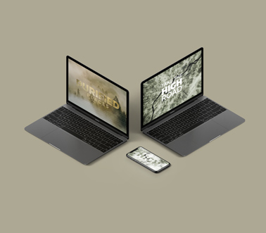 Два серых ноутбука MacBook и iPhone