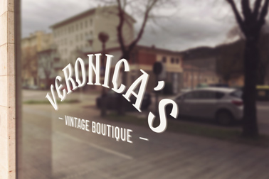 Logo Signage on a Faded Window