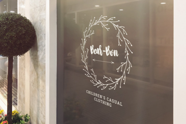 Window Signage next to a Street Tree