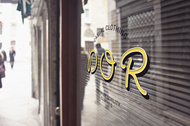 Logo Signage on a Window with Blinds Inside