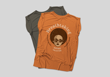 Two Muscle Tank Tops Laid Out on One Another