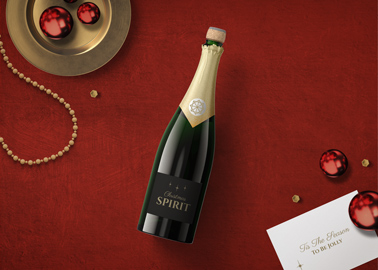 Champagne with Christmas Ornaments and a Card