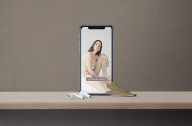 Vertical iPhone and Airpods on a Desk