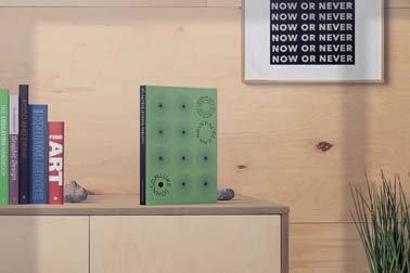 Standing Book next to Book Collection on a Cabinet