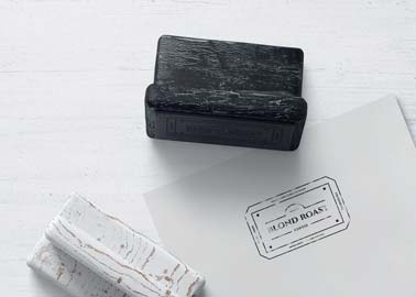 Two Wooden Stamps with a Business Flyer