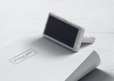 Wooden Stamp and a Flyer From Right Side