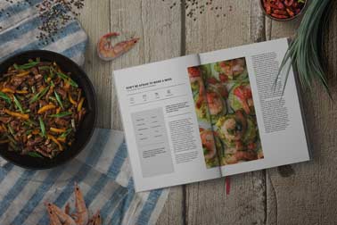 Open Recipe Book with Seafood and Spices