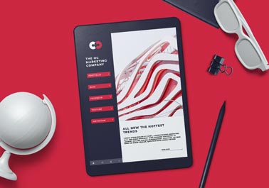 iPad and Stationery on a Red Surface