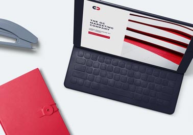 MacBook, a Button Notebook, and a Stapler