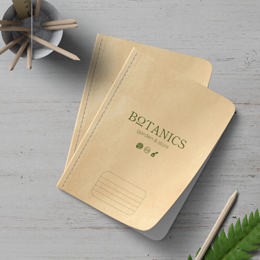 Two Copybooks and a Pencil Holder on a Desk