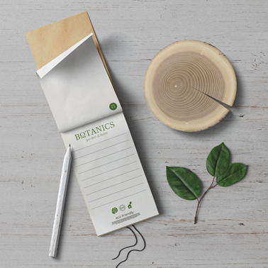 Notebook, a Pencil, and a Log on a Desk