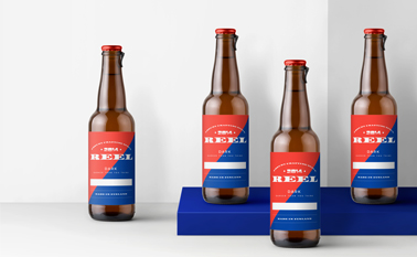 Four Beer Bottles on a White Surface