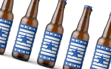 Zoomed Beer Bottles on a Yellow Surface