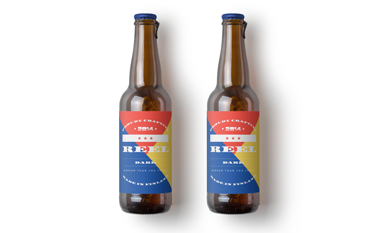 Two Beer Bottles on a White Surface