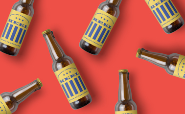 Asymmetric Beer Bottles on a Red Surface