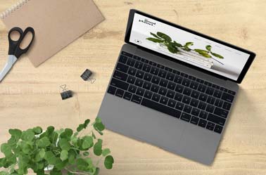 MacBook and Stationery on a Desk