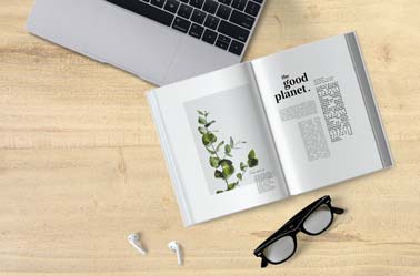 Open Book and AirPods on a Desk