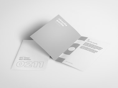 Two Booklets on a White Surface