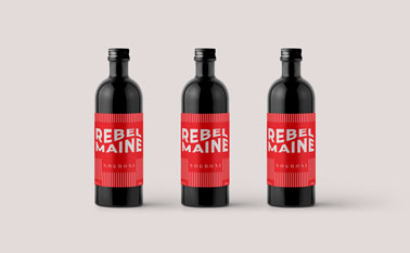 Three Bottles on a Beige Surface