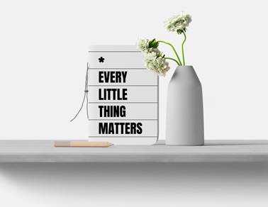 Notebook, a Flower Vase, and a Pencil