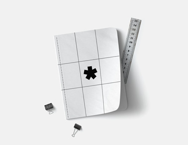 Notebook and Stationery on a White Surface