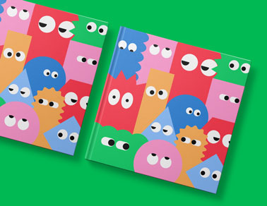 Two Square Books on a Green Background