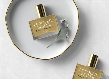 Two Perfume Bottles, One on a Plate