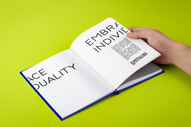 Hand Holding and Turning Book Pages